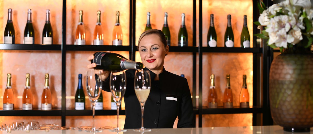 Treat yourself with a glass of champagne at the bar